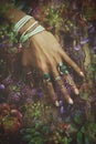 Woman hand on tree surface with lot of boho style jewrly, rings Royalty Free Stock Photo