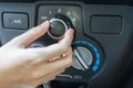 Woman hand turning on car air conditioning system Royalty Free Stock Photo