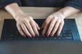 Woman hand typing on keyboard computer laptop searching job Royalty Free Stock Photo