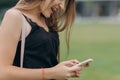 Woman hand typing message on screen smartphone. Close up female hands holding smartphone and browsing website. Female Royalty Free Stock Photo