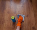 A woman hand Using blue rags wipe the wooden floor Royalty Free Stock Photo