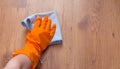 A woman hand Using blue rags wipe the wooden floor Royalty Free Stock Photo