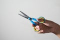 Girl hand using colorful scissors. Royalty Free Stock Photo