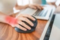 Woman hand using computer ergonomic mouse, prevention wrist pain because working long time. De Quervain s tenosynovitis,