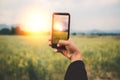 Woman hand using mobile phone photo. Mountain nature Royalty Free Stock Photo