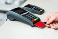 Woman hand using payment terminal in  shop. Paying with credit or dedit card, credit card reader Royalty Free Stock Photo