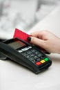 Woman hand using payment terminal in  shop. Paying with credit or dedit card, credit card reader Royalty Free Stock Photo