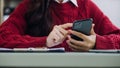 Woman hand using smart phone and laptop in outdoor nature park and sunset sky with bokeh light abstract background. Technology Royalty Free Stock Photo