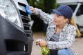 Woman hand washing car headlights Royalty Free Stock Photo