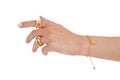 Woman hand wearing golden butterfly bracelet and Interlocked Golden and Silver Rings set against a white background. Beautiful