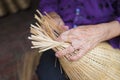 Woman hand weaving tropical bamboo fish trap in traditional crafts village in Vietnam Royalty Free Stock Photo
