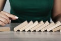 woman hand wooden cubes on tableÃÂ±