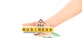 Woman hand with word business and house with euro Royalty Free Stock Photo