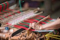 Woman hand working at loom close up Royalty Free Stock Photo