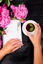 Woman hand writing diary, or letter, note with cup of coffee Royalty Free Stock Photo