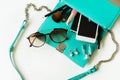 Woman handbag with makeup, cellphone and accessories Royalty Free Stock Photo