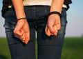 Woman with handcuffed hands