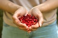 Woman with handful of fresh wild strawberries , closeup Royalty Free Stock Photo