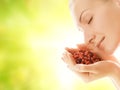 Woman with handful of strawberries