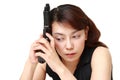 Woman with a handgun thinks Royalty Free Stock Photo