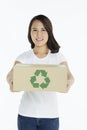Woman handing out a cardboard box Royalty Free Stock Photo