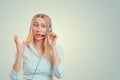 Woman hands in air aggravated talking on headset