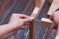 Woman hands assembling wooden furniture with tools during quarantine isolation Royalty Free Stock Photo