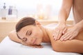 Woman, hands and back massage at spa, aromatherapy and healing with wellness. Calm, peace and beauty with skincare, body Royalty Free Stock Photo