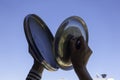 Woman hands banging pot lids against blue sky. Protest against the government measures. Banging pots and pans from the Royalty Free Stock Photo