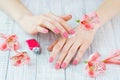 Woman hands with beautiful pink matted manicure