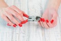 Woman hands with beautiful red manicure on fingernails
