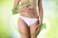 Woman hands on belly with green arrow Royalty Free Stock Photo