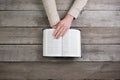 Woman hands on bible. she is reading and praying over bible Royalty Free Stock Photo