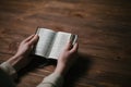 Woman hands on bible. she is reading and praying Royalty Free Stock Photo