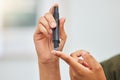 Woman, hands and blood sugar test of diabetes, healthcare analysis or medical glucometer results. Closeup of person poke