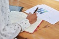 Woman, hands and book for planning at desk, statistics and graphs on consumer feedback. Female person, journal and notes Royalty Free Stock Photo