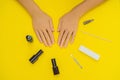 Woman Hands Care. Top View Of Beautiful Smooth Woman`s Hands With Professional Nail Care Tools For Manicure On yellow Royalty Free Stock Photo