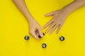 Woman Hands Care. Top View Of Beautiful Smooth Woman`s Hands With Professional Nail Care Tools For Manicure On yellow Royalty Free Stock Photo