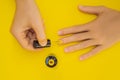 Woman Hands Care. Top View Of Beautiful Smooth Woman`s Hands With Professional Nail Care Tools For Manicure On yellow Royalty Free Stock Photo