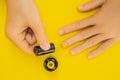 Woman Hands Care. Top View Of Beautiful Smooth Woman`s Hands With Professional Nail Care Tools For Manicure On yellow Royalty Free Stock Photo