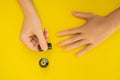 Woman Hands Care. Top View Of Beautiful Smooth Woman`s Hands With Professional Nail Care Tools For Manicure On yellow Royalty Free Stock Photo