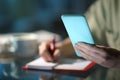 Woman hands checking phone agenda and taking notes Royalty Free Stock Photo