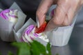 Woman hands chef decorating Cupcakes with pink butter cream Royalty Free Stock Photo