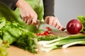 Woman hands chopping vegetables