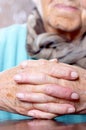 Woman with hands clasped