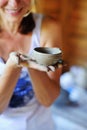 Woman hands in clay holding handmade pot Royalty Free Stock Photo