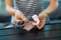 Woman hands cleaning and wiping sun glasses with micro fiber wipe