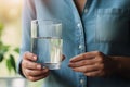 Woman hands close up holding glass mineral water young lady drinking fresh clear health pure refreshing beverage
