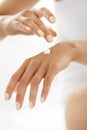 Woman Hands With Cream. Closeup Of Female Hands Applying Lotion Royalty Free Stock Photo