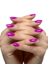 Woman hands crossed with fucsia nails manicure